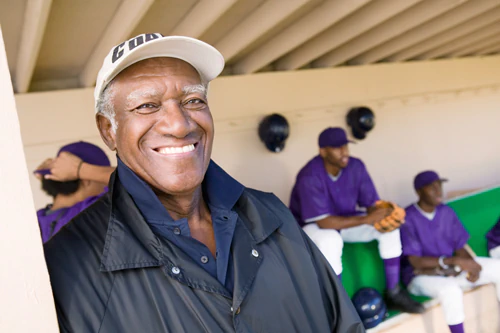 Baseball coach standing in the dugout