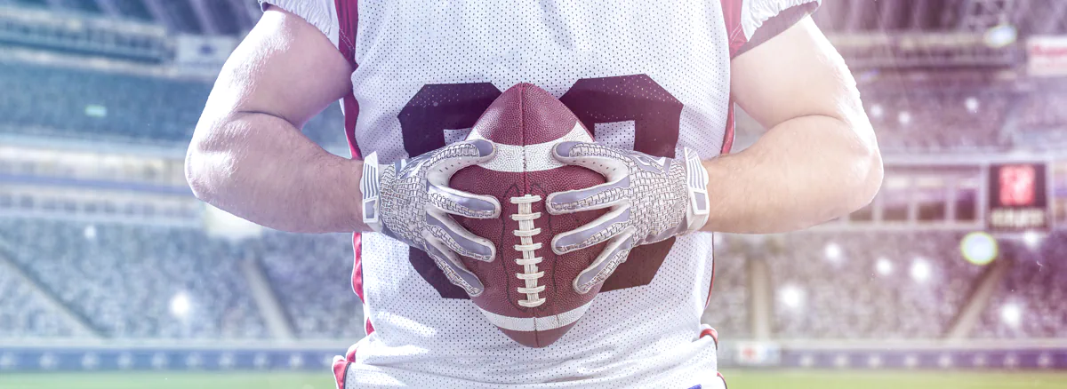 Football Player on field with lights and flares